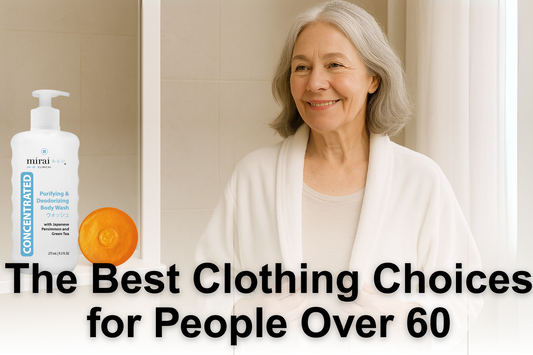 Smiling older woman in a white robe standing in a bathroom, next to Mirai Clinical Purifying & Deodorizing Body Wash with Japanese persimmon and green tea.
