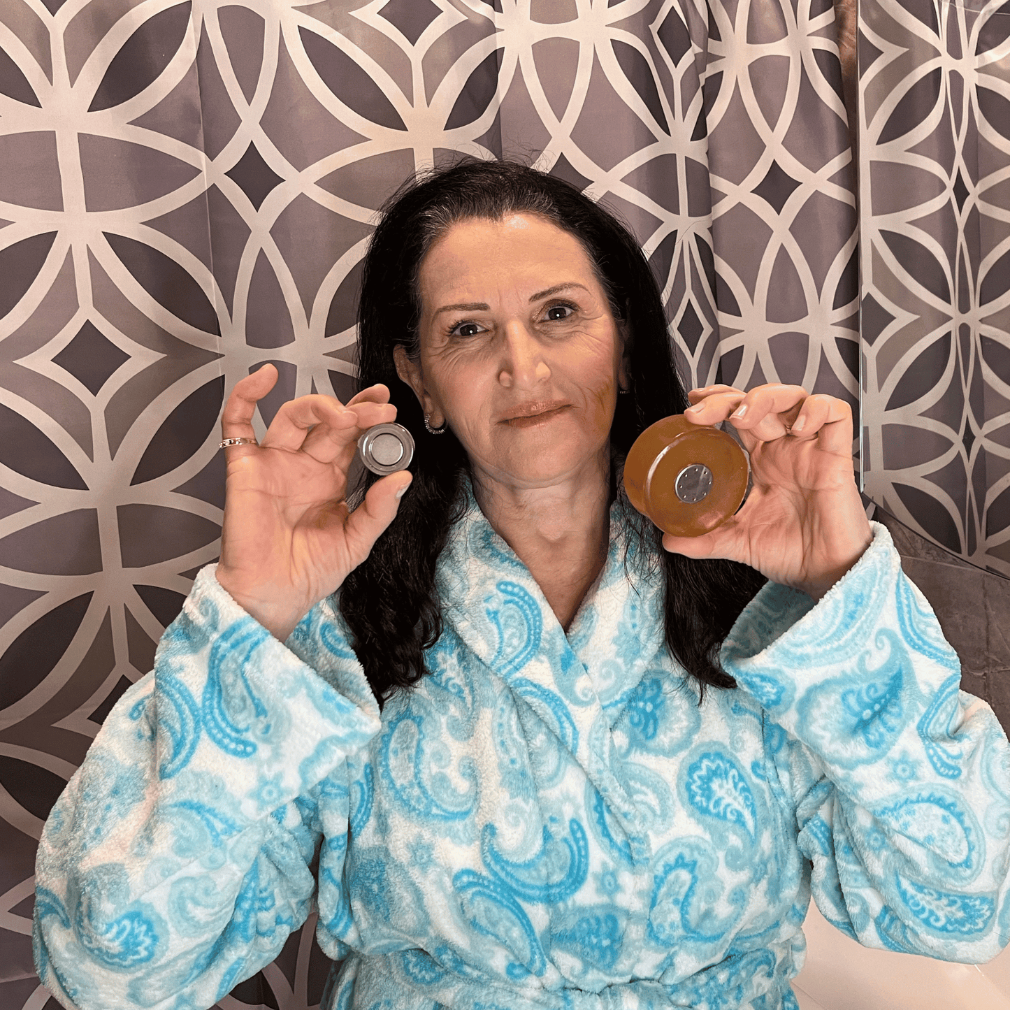 Woman highlighting the dual features of Mirai Clinical's soap bar complemented by its magnetic attachment, showcasing the brand's inventive solution for efficient soap usage and storage.