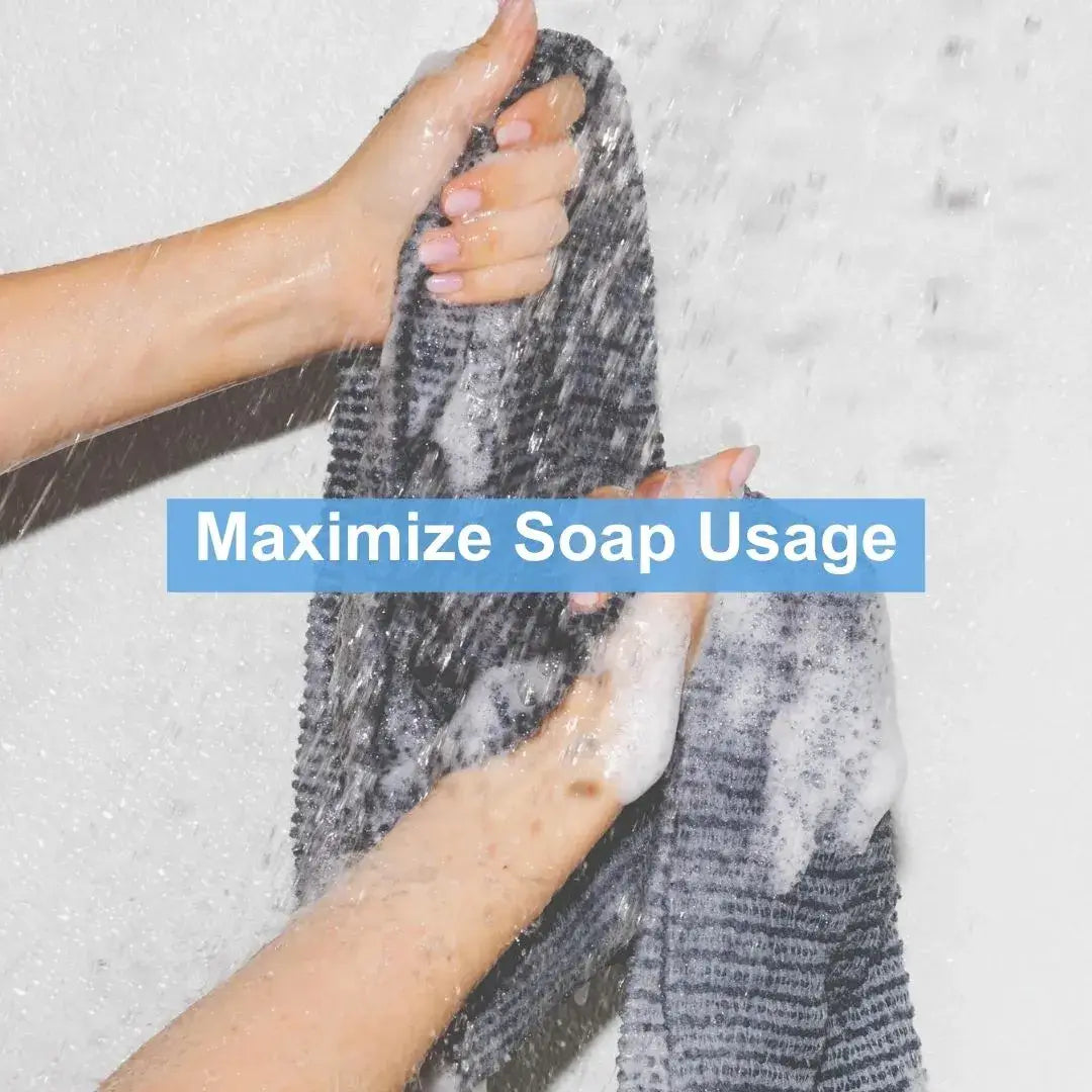Person using a towel to maximize soap usage with rich bubbles from Mirai Clinical soap.