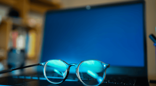 Glasses with Computer Screen in Background