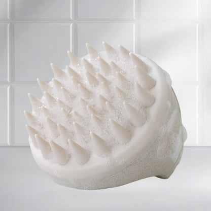 Front view of the Mirai Clinical Scalp Massager with silicone bristles.