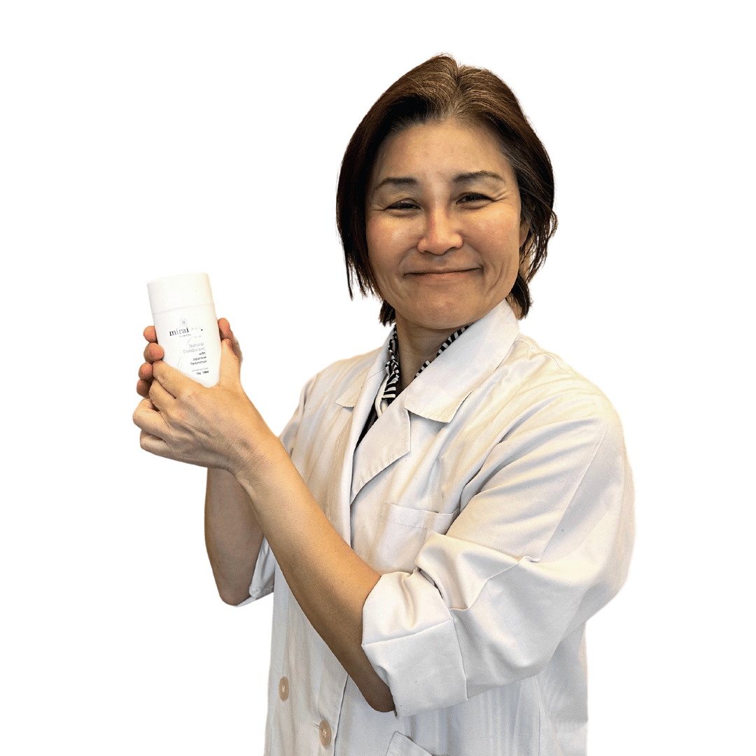 Dr. Yoko representing Mirai Clinical, holding a persimmon-enriched body lotion that offers deodorizing benefits against nonenal-related body odor.