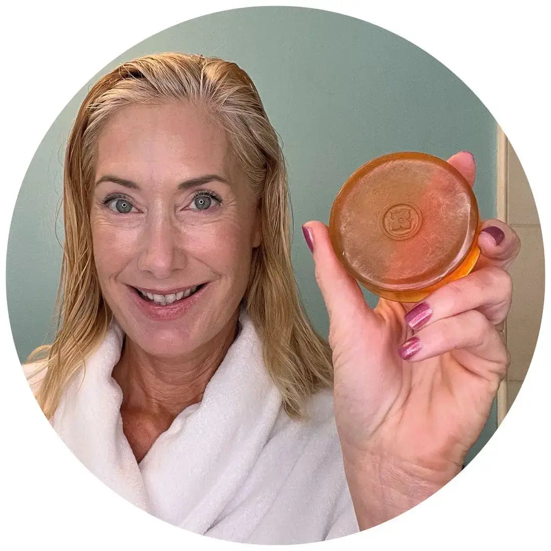 Customer showcasing Mirai Clinical soap bar, highlighting its effectiveness for reducing nonenal and body odor.