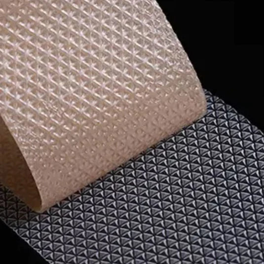 Distinctive grip pattern of Koko Face Yoga's Sleep Tape, displayed against a stark black background, highlighting its design features that ensure a secure fit during sleep.