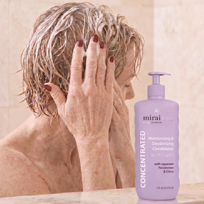 Woman using Mirai Clinical persimmon moisturizing deodorizing conditioner to support scalp hygiene and help reduce nonenal aging body odor.