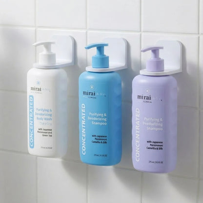Mirai Clinical body wash, Shampoo and Conditioner secured in wall-mounted holder for convenience.
