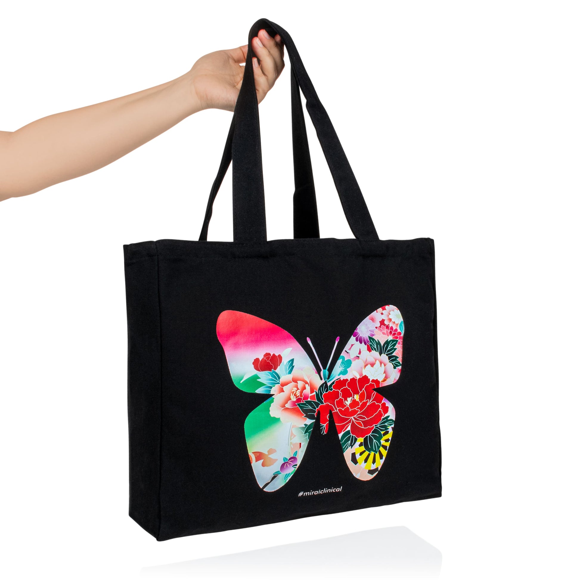 Mirai Clinical black tote bag with butterfly design, included in the Halloween bundle offer.