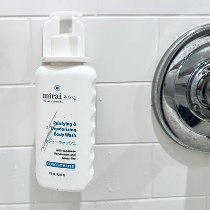 Mirai Clinical body wash securely mounted in holder, shower-ready.