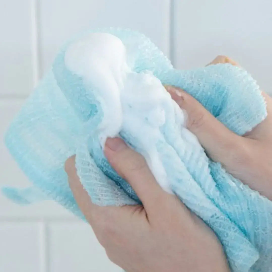 Showcasing the rich lather of the Mirai Clinical Bubble Rich Towel for effective and gentle cleansing.