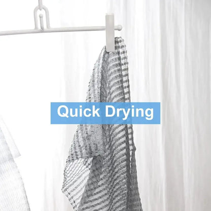 Mirai Clinical Bubble Rich Towel hanging to dry, showcasing its quick drying feature.