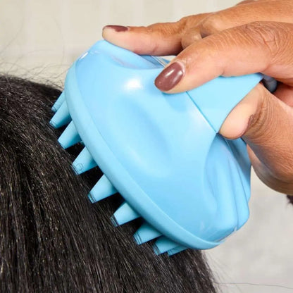 Mirai Clinical scalp massager stimulating scalp and improving circulation.