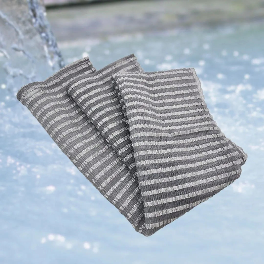 Bubble Rich Bath Towel by Mirai Clinical, creating a luxurious, foamy lather for deep cleansing and exfoliation.