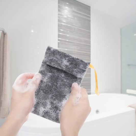 Mirai Clinical Soap Saver Bag being lathered with soap in a bathroom setting.