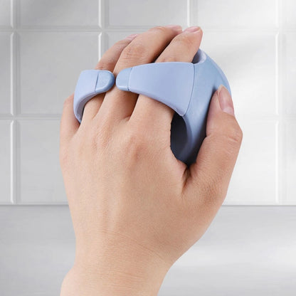 Back view of Mirai Clinical Scalp Massager held in hand, highlighting its ergonomic grip and soft silicone bristles.