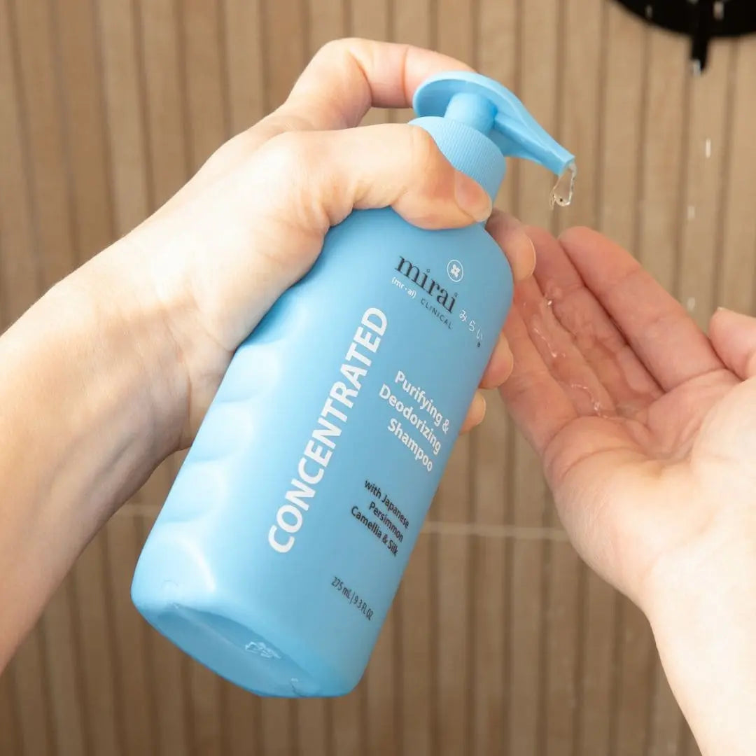 Mirai Clinical Purifying & Deodorizing Shampoo bottle with Japanese persimmon and camellia, designed to cleanse and nourish hair while deodorizing.