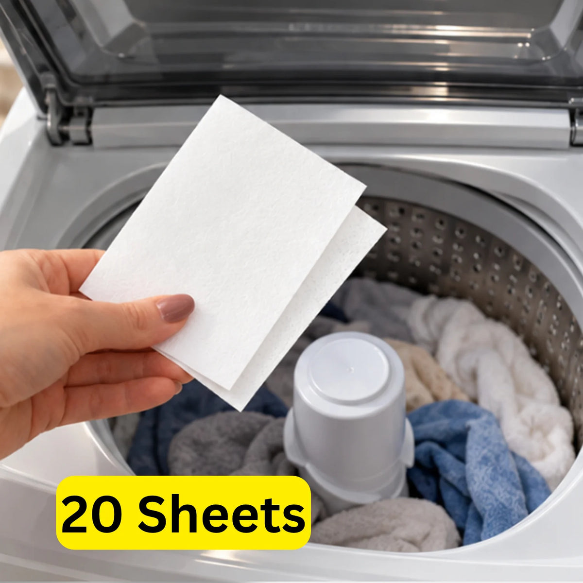 Hand placing an unscented Mirai Clinical Persimmon Laundry Detergent Sheet into a top-loading washing machine filled with clothes. Text: 20 sheets.