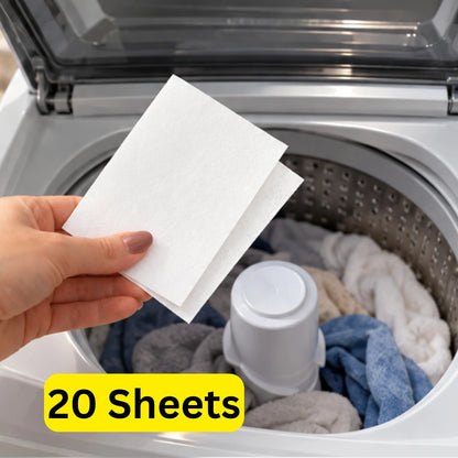 Hand placing an unscented Mirai Clinical Persimmon Laundry Detergent Sheet into a top-loading washing machine filled with clothes. Text: 20 sheets.