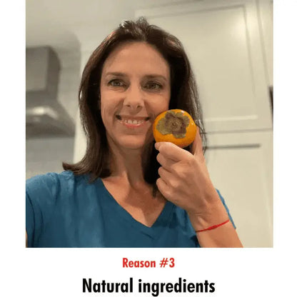 Woman showcasing a persimmon, highlighting its natural deodorizing benefits for reducing nonenal and body odor, used in Mirai Clinical products.