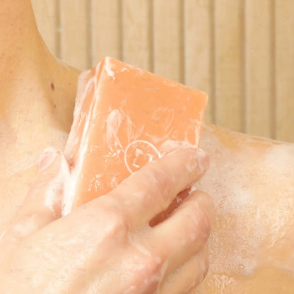 Lathering the Sensitive Soap Bar on skin, showing creamy foam and gentle cleansing for sensitive areas. Contains persimmon extract to target Nonenal body odor.