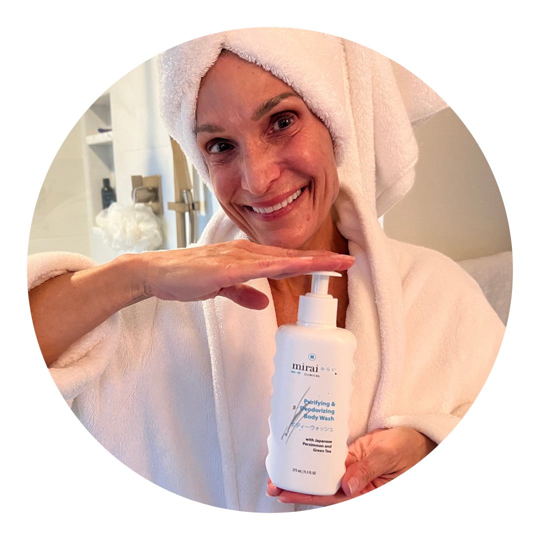 Sondra W. happily holding Mirai Clinical’s Purifying & Deodorizing Body Wash, sharing a subscription review about its effectiveness in eliminating nonenal body odor.
