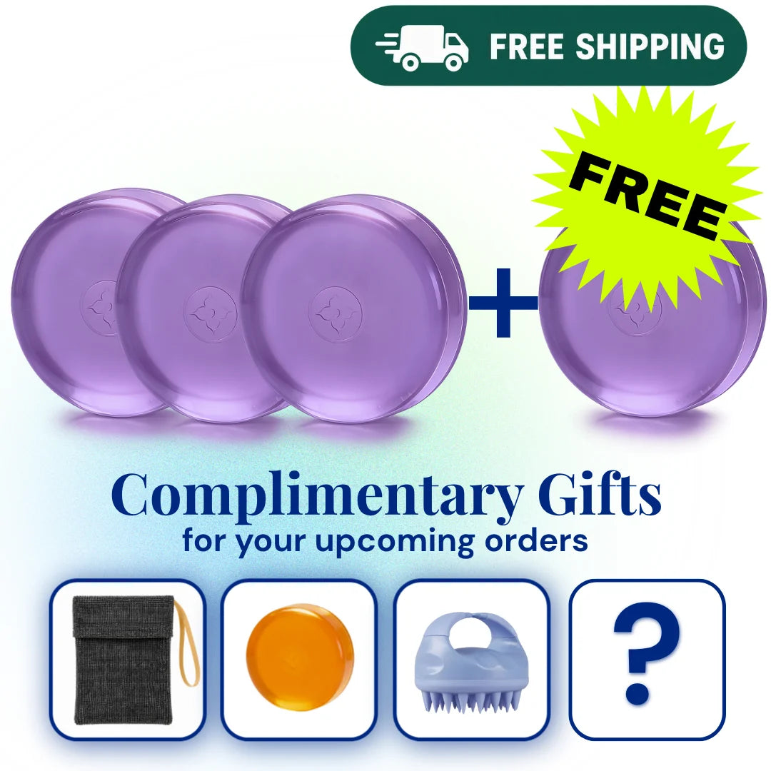 Four translucent purple oval bath or body soaps are shown on a white background with promotional text reading 'FREE SHIPPING' and 'Complimentary Gifts for your upcoming orders,' plus a yellow 'FREE' burst and small gift box icons below.