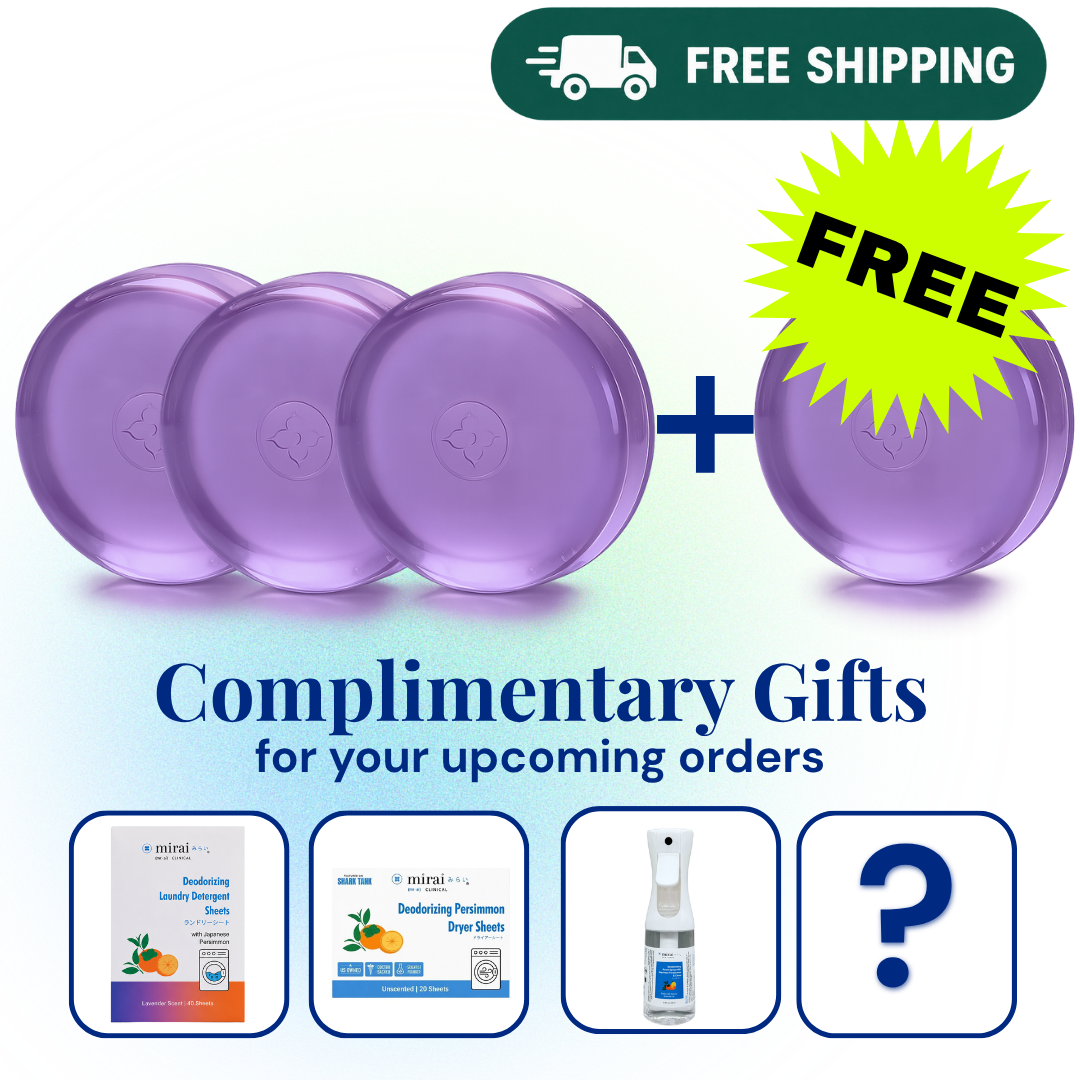 Promotional graphic showing four purple round bars of soap plus a yellow starburst that says FREE, with a green 'FREE SHIPPING' banner at the top and text reading 'Complimentary Gifts for your upcoming orders.' Four small product preview cards appear along the bottom, including a spray bottle and a question mark representing included gifts.


