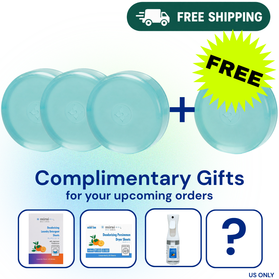 Promotional graphic showing four round light blue bath towels with a plus sign and a yellow starburst reading FREE, above the text 'Complimentary Gifts for your upcoming orders.' Four small product preview boxes below show sample gift items, including a laundry product, dryer sheets, a spray bottle, and a question mark.