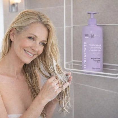 Mirai Clinical persimmon deodorizing hair conditioner used by woman in shower to eliminate nonenal scalp odor