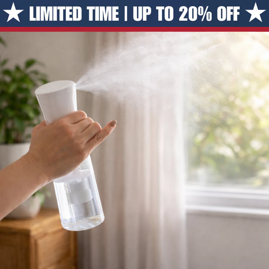 Hand holding white room spray bottle misting a fine spray over sheer curtains in a sunlit room with a potted plant — limited time offer, up to 20% off
