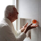 Elderly man utilizing Mirai Clinical's Magnetic Soap Bar Holder, designed for efficient soap storage and longevity.