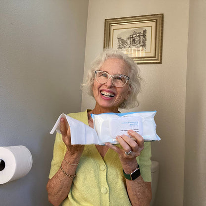 Woman confidently displaying Mirai Clinical's Deodorizing Body Wipes with Japanese Persimmon, a solution for nonenal body odor.