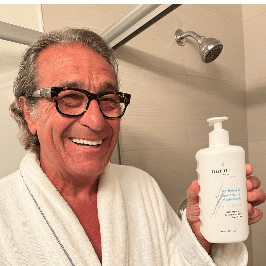 Man showcasing Mirai Clinical Body Wash, specifically formulated with persimmon extract for deodorizing and combating nonenal-related body odor.